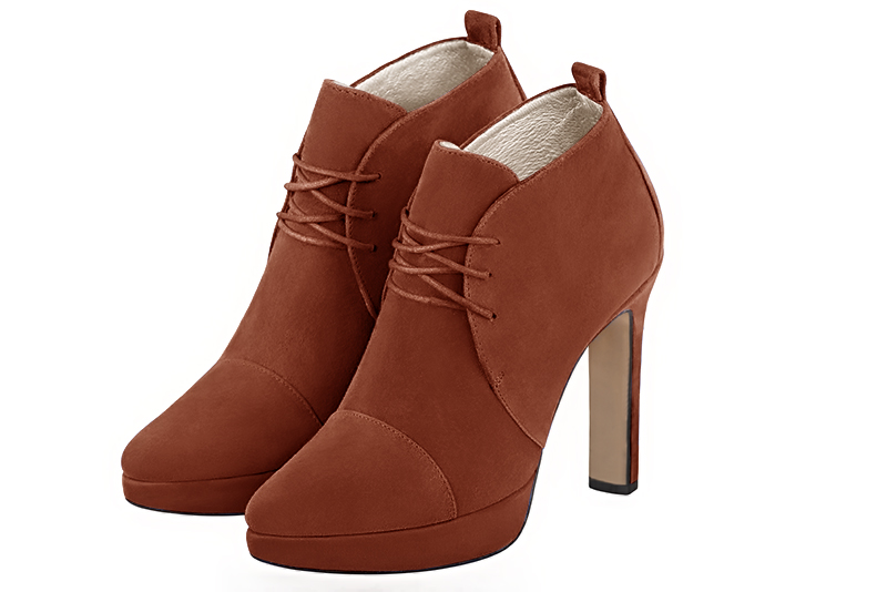 Terracotta orange women's ankle boots with laces at the front. Tapered toe. Very high slim heel with a platform at the front. Front view - Florence KOOIJMAN